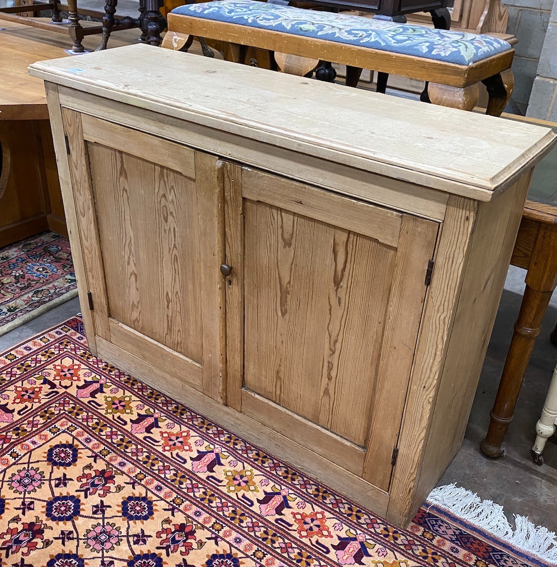 An Edwardian pine cupboard, width 126cm height 94cm